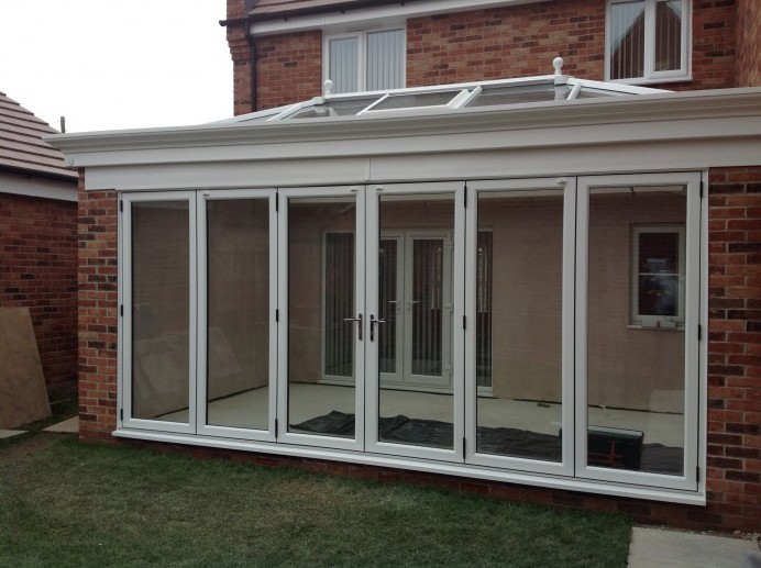 White Orangery Installed With Six Pane Bi Fold Door