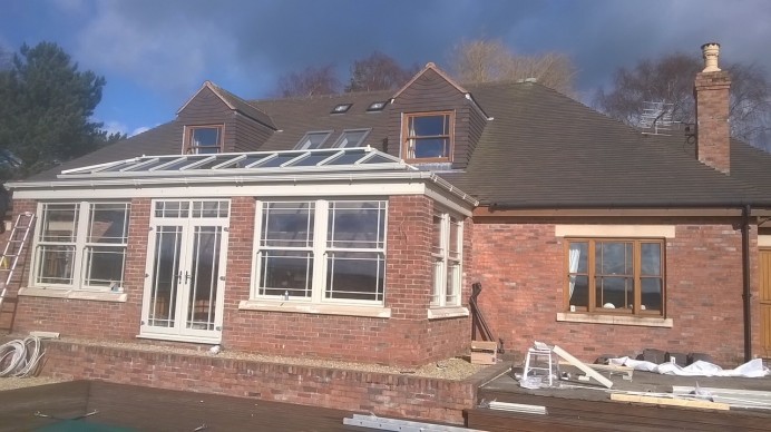 Orangery Fitting Complete with Sash Windows and Doors