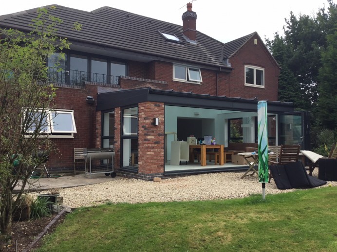 Walnut Conservatory Transformed into Bespoke Glass Building in Anthracite Grey