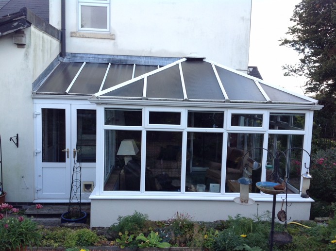 White uPVC Conservatory Transformed into Rehau Chartwell Green