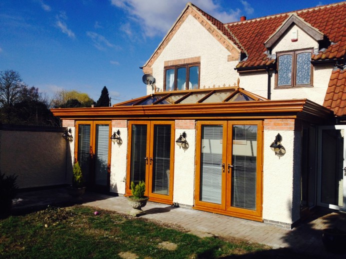 Golden Oak Orangery Fitted with Three Sets of Patio Doors