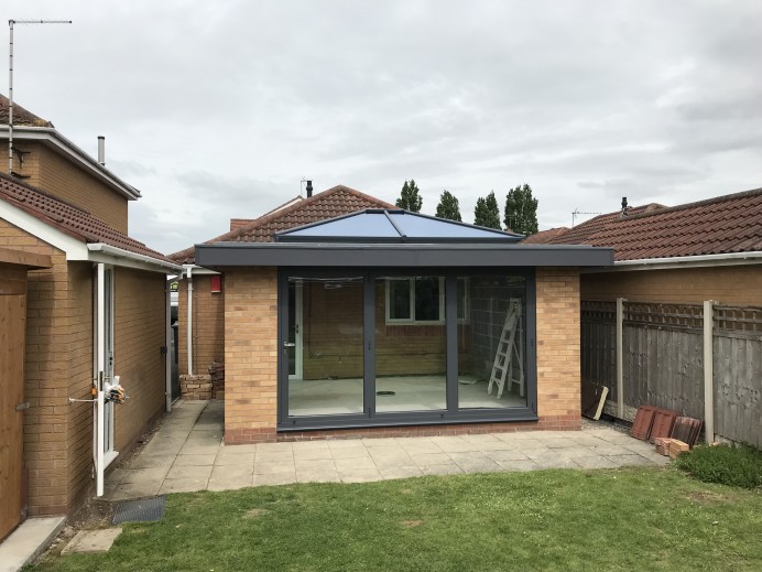 Orangery with Brick Work Exterior and Origin Bi Fold Doors