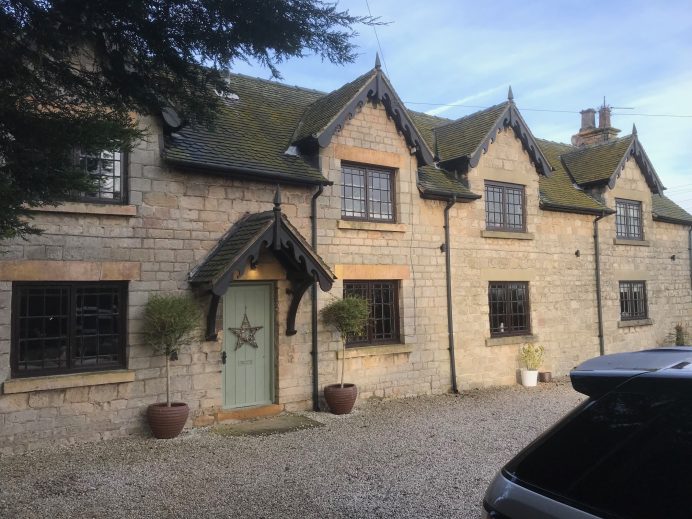 Classic Stone Work Building Fitted With Beautiful Classic Designed Windows and Bi Fold